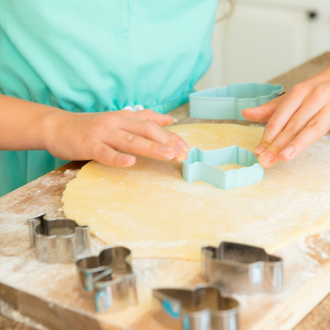 Lifestyle photo of child using Ice Cream Parlor Set of 2 Cookie Cutters to cut cookie dough
