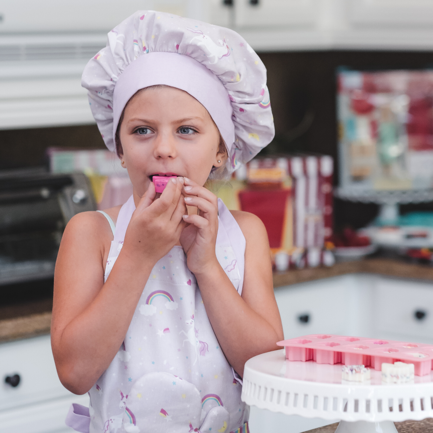 Lifestyle image of girl wearing youth unicorn apron