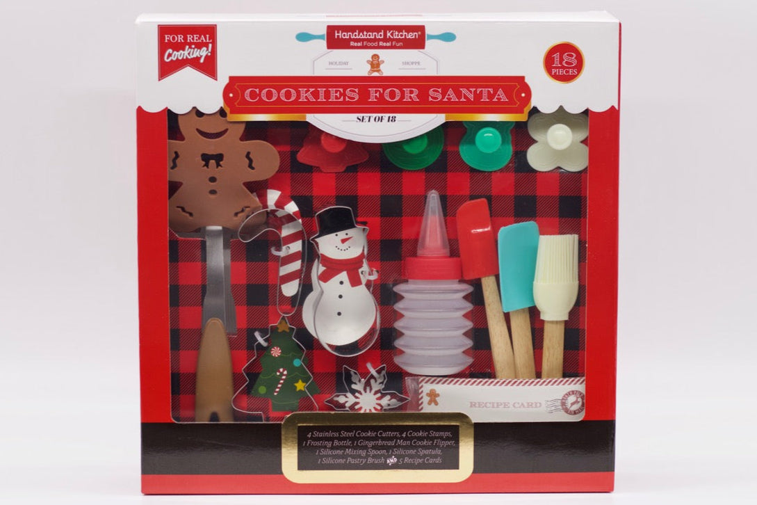 Christmas-themed cookie cutters set in a box with a red plaid pattern on a white background.