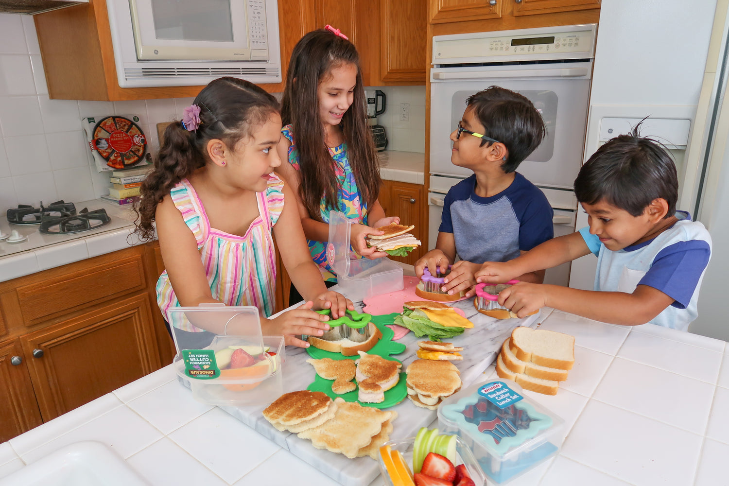 lifestyle image of a family making sandwiches 