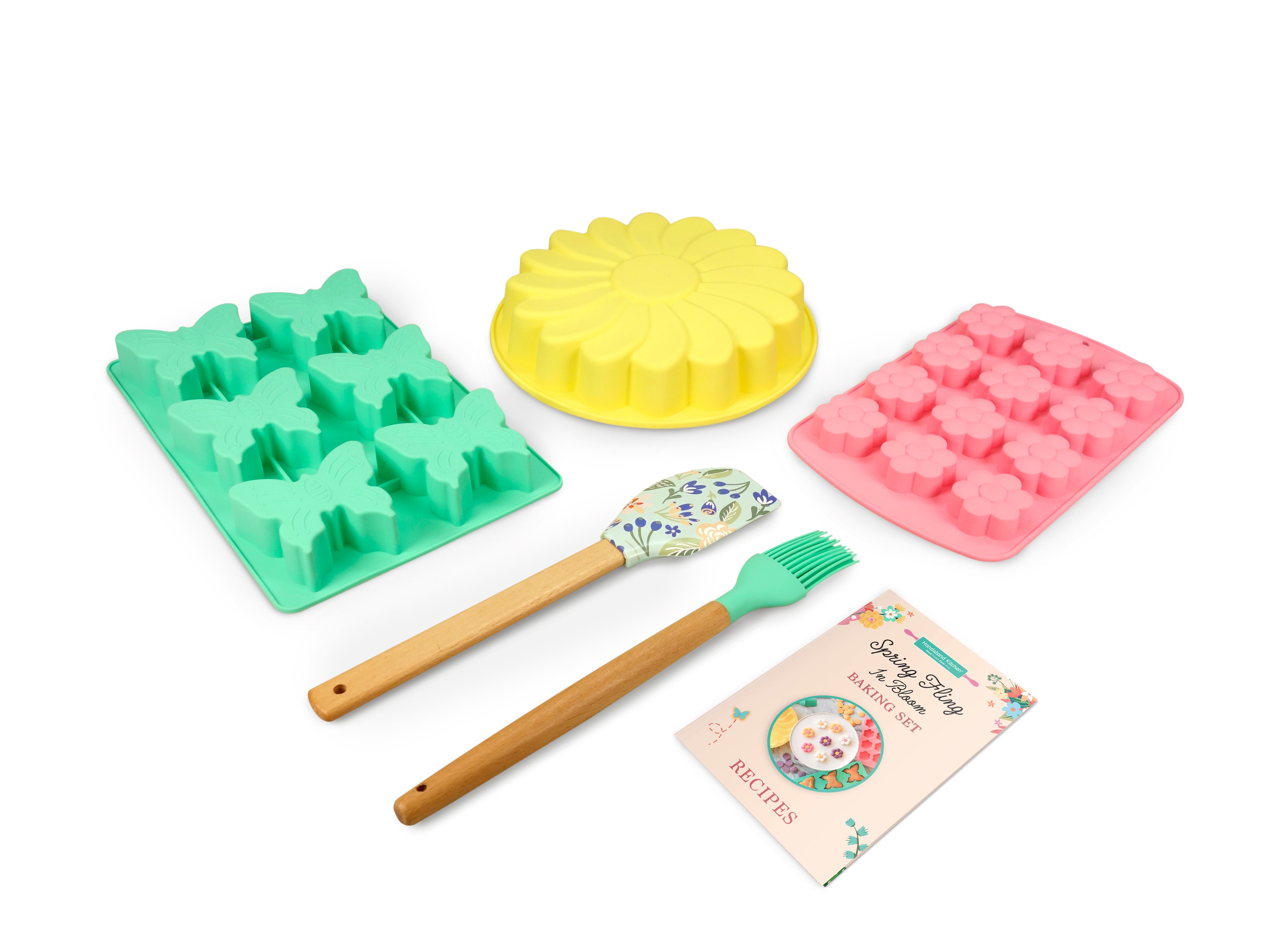 Out of box image of Spring Fling In Bloom Baking Set which includes 1 Silicone Daisy Cake Mold, 1 Silicone Butterfly Cupcake Mold, 1 Silicone Mini Daisy Mold, 1 Silicone Spatula, 1 Silicone Pastry Brush and Recipes