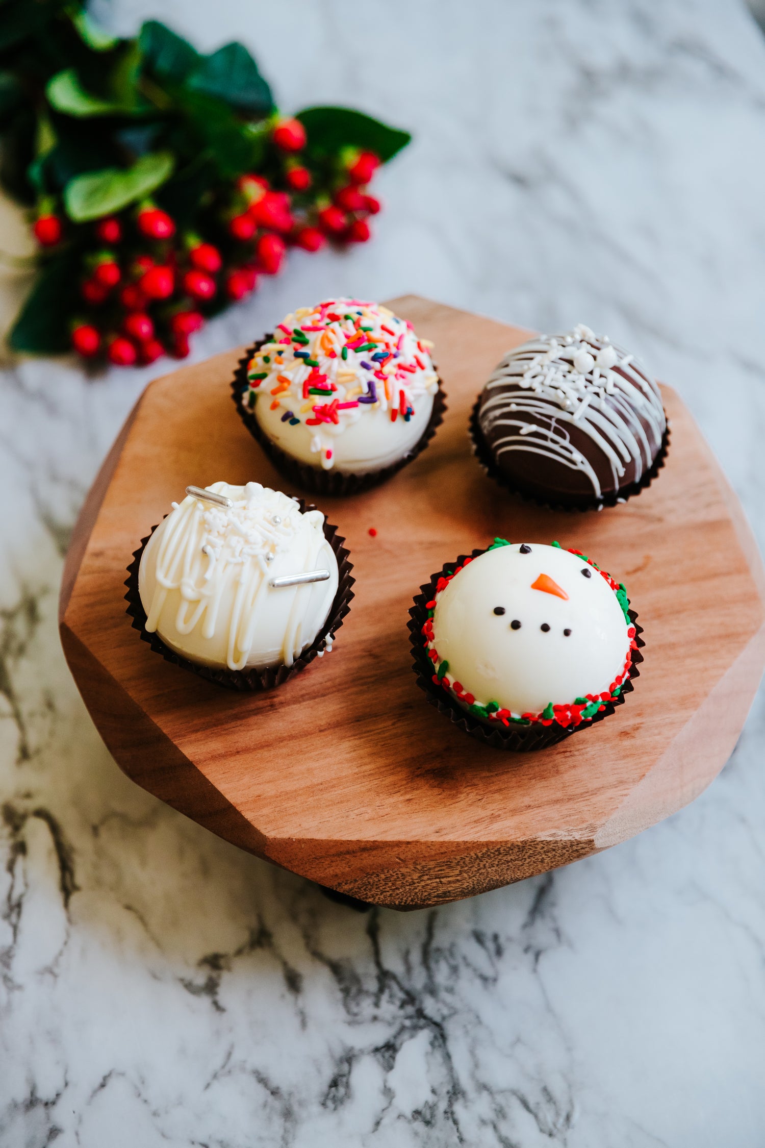 Lifestyle image of 4 decorated hot cocoa bombs