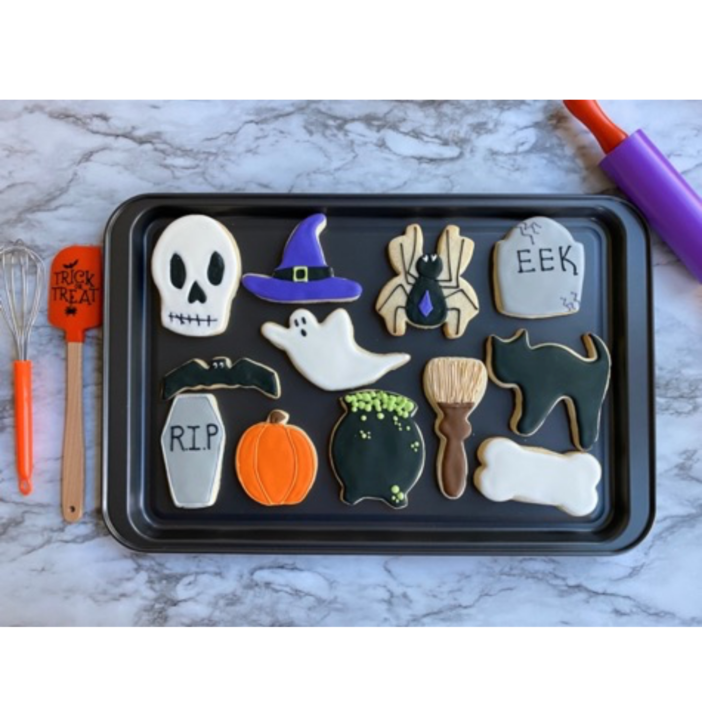 Lifestyle image of decorated halloween cookies.