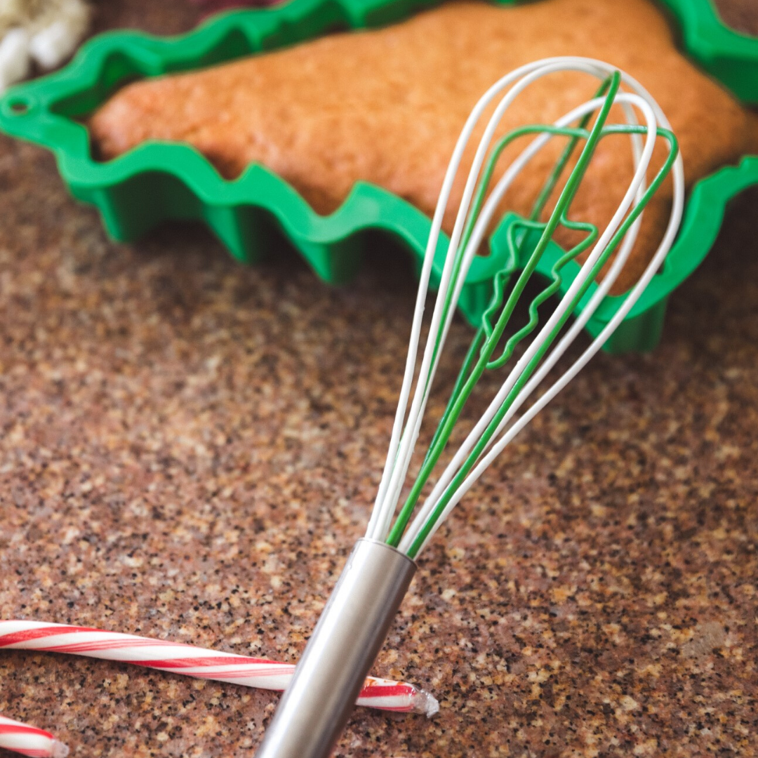 Lifestyle image of Holiday tree cake and whisk
