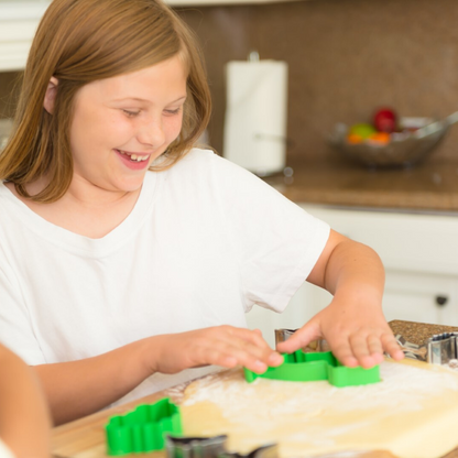 Kid using Dinosaur Shaped Cookie Cutter 10 Piece Set