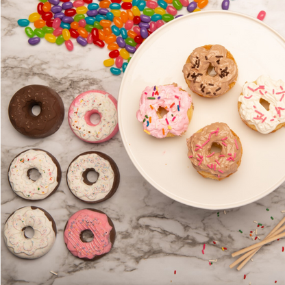 Lifestyle image of donut shaped cupcakes made with Donut Shoppe Cupcake Mold and decorated with frosting and sprinkles