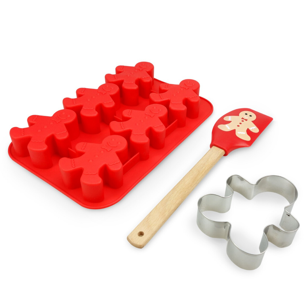 Out of box image of Gingerbread Man Baking Set containing 1 silicone cupcake mold with 6 gingerbread man shapes, 1  gingerbread man silicone spatula and 1 gingerbread man stainless steel cookie cutter.