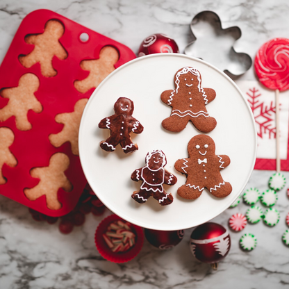 Lifestyle image of Gingerbread Man Baking Set with decorated gingerbread cookies and cupcakes
