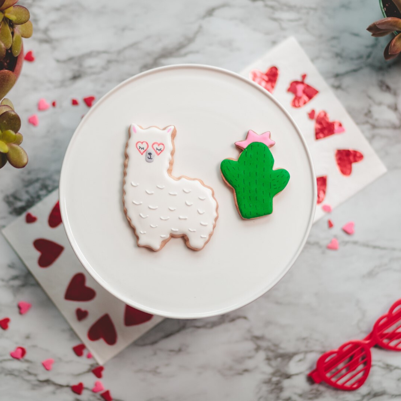 Llama and cactus shaped cookies decorated with icing made using Llama love set of 2 cookie cutters