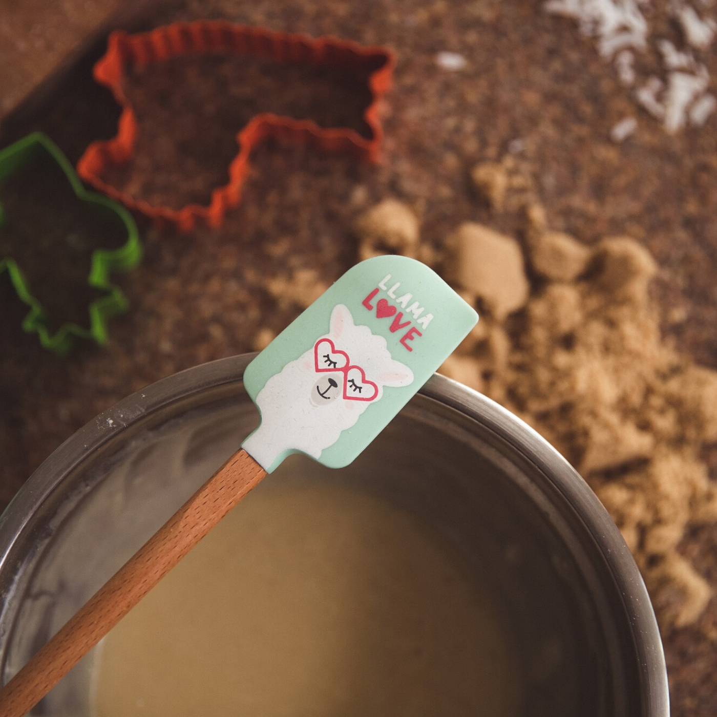 Lifestyle photo of spatula that says &quot;llama love&quot; from Llama Love Ultimate Baking Party Set