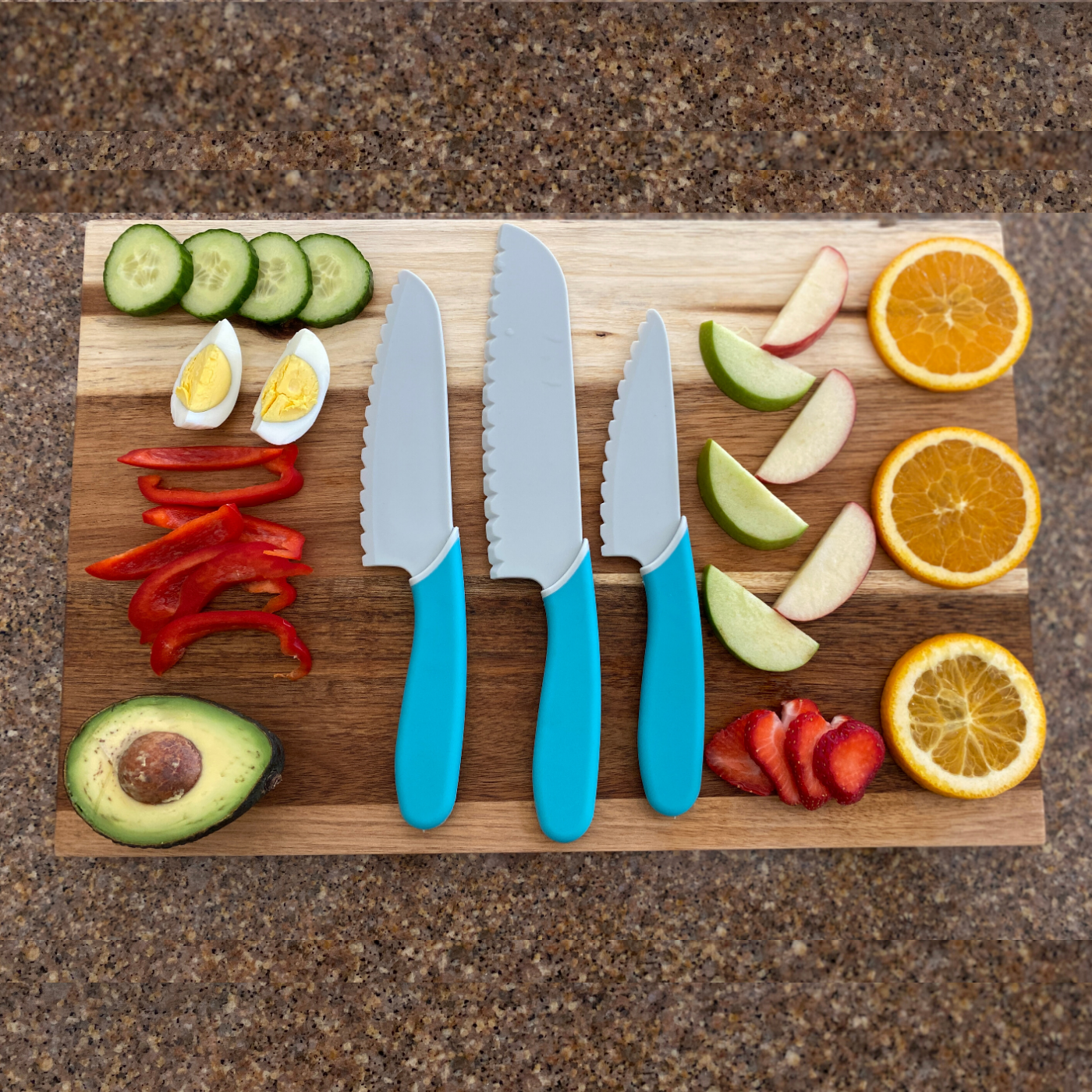 The Chopping Block Kid Safe Knife Set lifestyle photo pictured with sliced fruit and vegetables