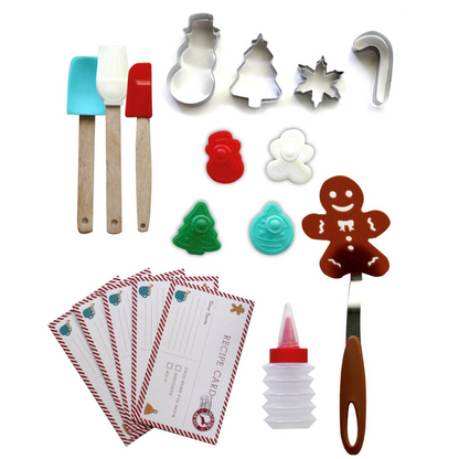 Out of box image of Cookies for Santa Kids Holiday Baking Kit containing : 4 stainless steel cookie cutters, 4 cookie stamps, 1 frosting bottle with tip and cap, 1 gingerbread man cookie flipper, 1 silicone mixing spoon, 1 silicone spatula, 1 silicone pastry  brush and recipes.