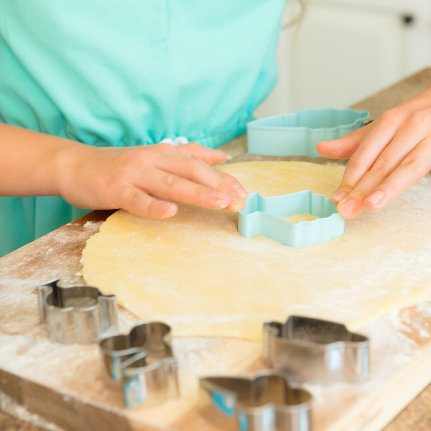 Lifestyle photo of child using Ice Cream Parlor Set of 2 Cookie Cutters to cut cookie dough