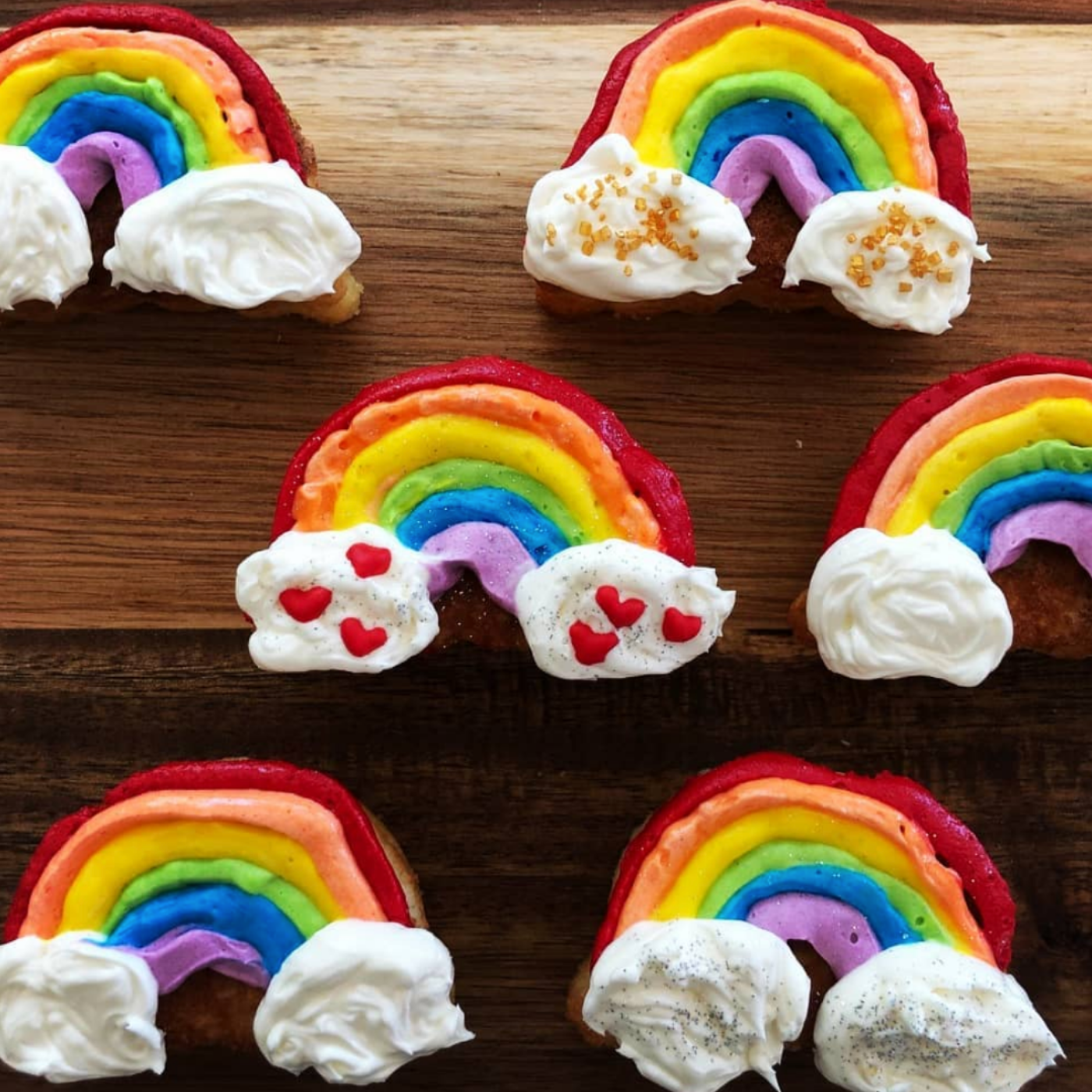 Lifestyle image of rainbow cupcake. 