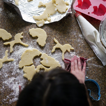Lifestyle image of Rainbows and Unicorns cookie cutters being used to make cookies