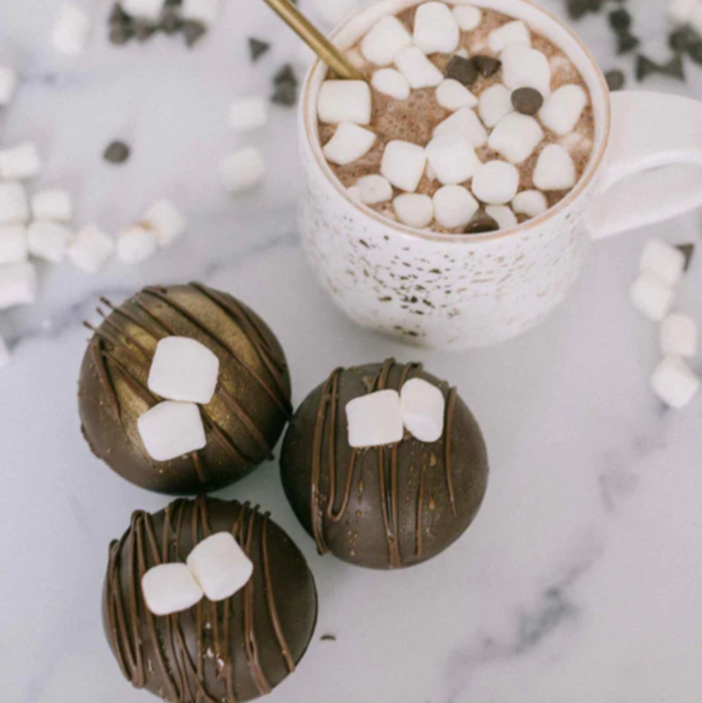 Lifestyle image of e decorated hot cocoa bombs 