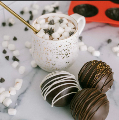 Lifestyle image of 3 decorated hot cocoa bombs 