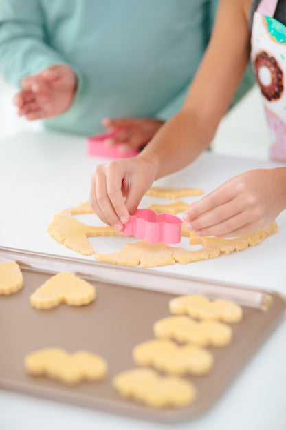 Lifestyle image of cookies being cut out 