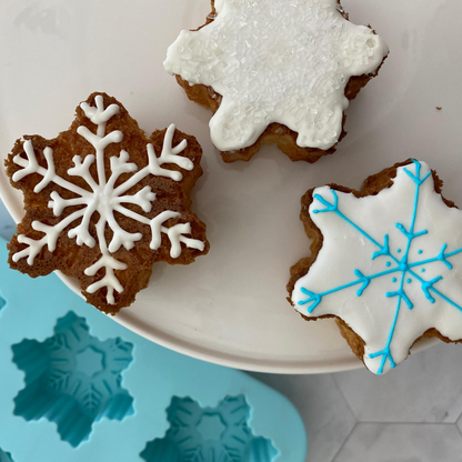 Lifestyle image of 3 decorated snowflake cupcakes 