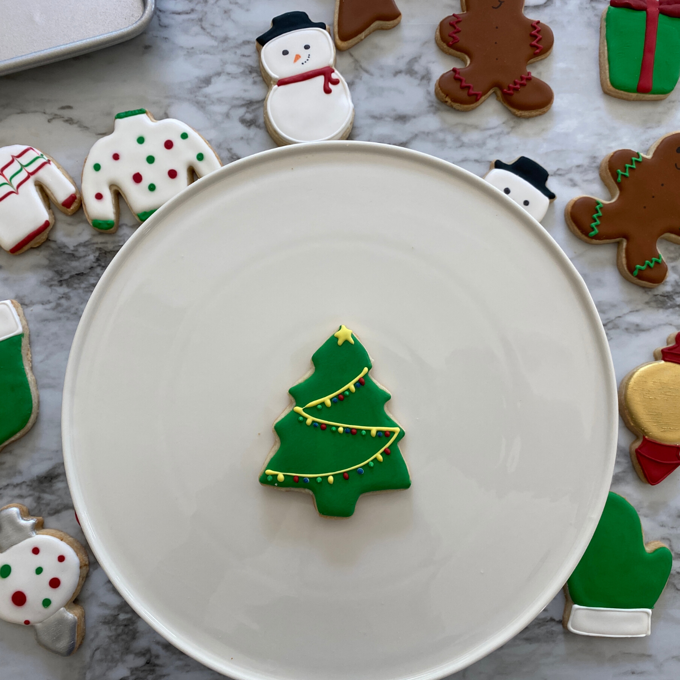 Lifestyle image of a decorated tree shaped cookie 